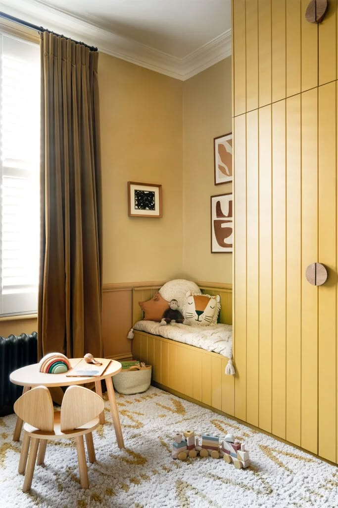 a child's room with yellow walls and furniture, including a small wooden table