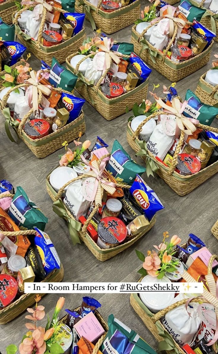 several baskets filled with different types of food and candys on the floor in front of each other