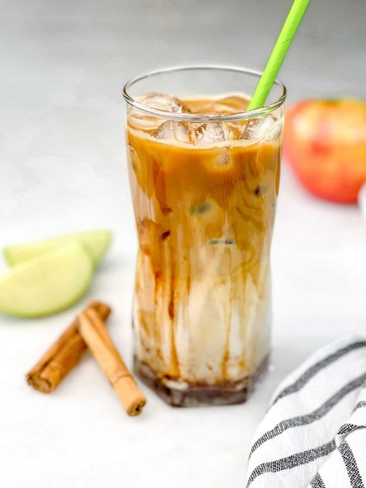 an iced drink with cinnamon and apple slices