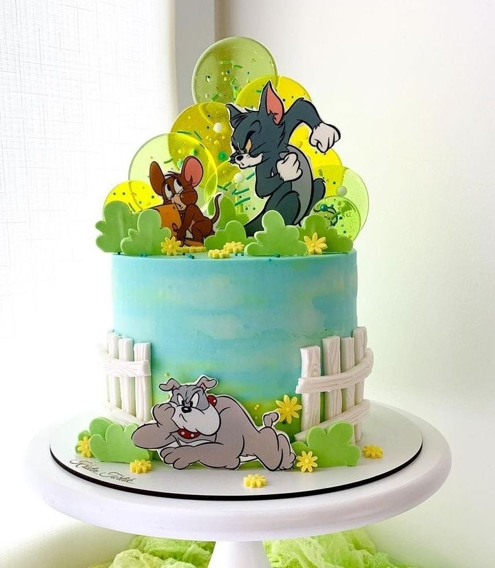 a cake decorated with cartoon characters on it