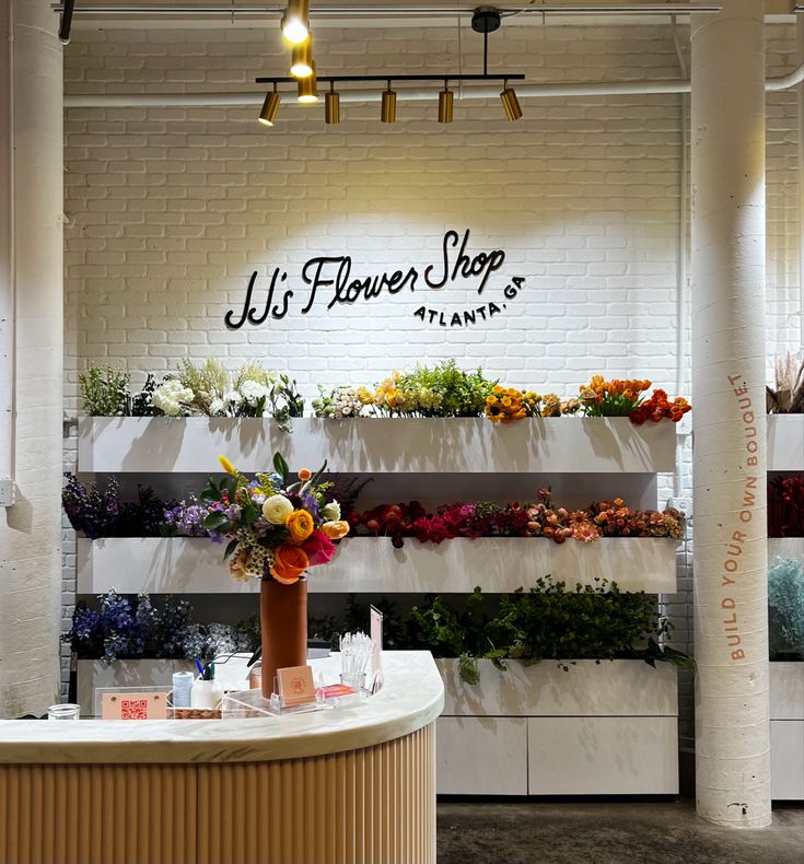 a flower shop with flowers on the counter