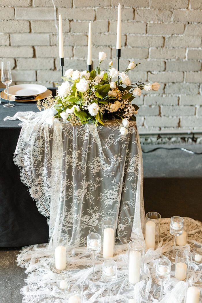 a table with candles and flowers on it