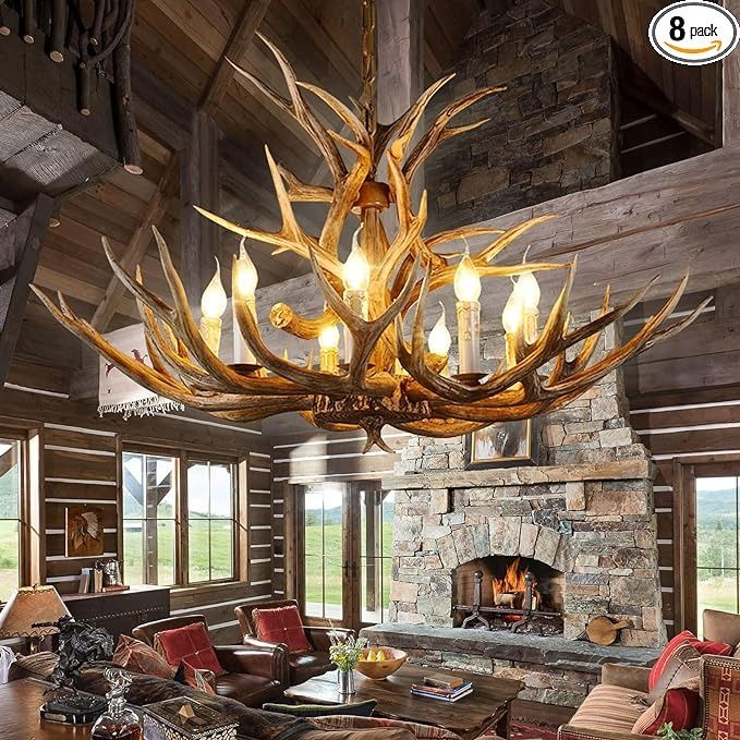 a large antler chandelier hangs from the ceiling in a rustic cabin style living room