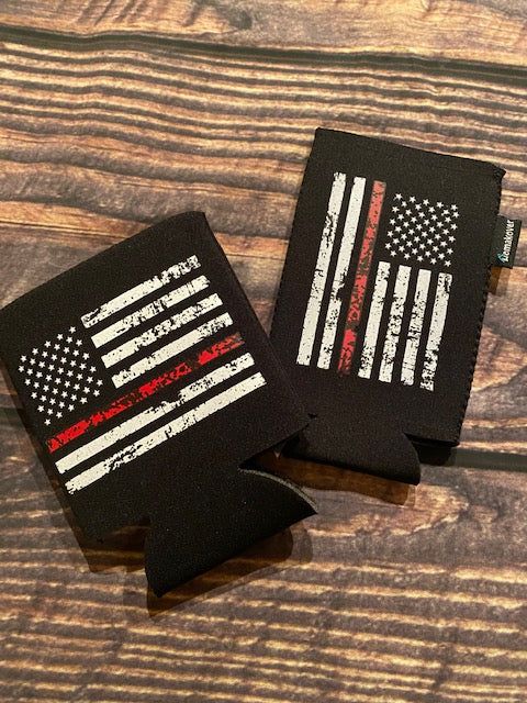 two black and red american flag coasters on a wooden table with one showing the back side