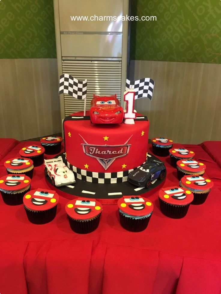 cars birthday cake and cupcakes on a table