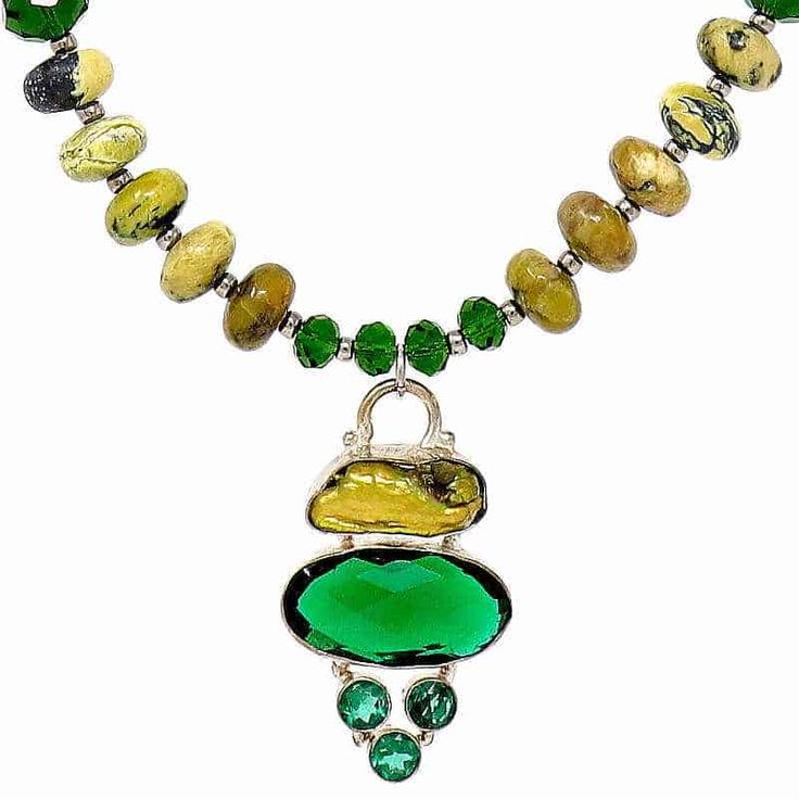 This exotic Yellow Turquoise Necklace features unique stones with black matrix, no two are exactly alike. The necklace showcases a biwa pearl green quartz oval pendant encased in a silver bail.  The pendant and the Yellow Turquoise Necklace is an unusual combination that works perfectly together.    Yellow Turquoise gets its name because it occurs in the same mines as Turquoise and has the same matrix patterns. Yellow turquoise is a serpentine or jasper stone that has similar properties to turqu Luxury Multicolor Crystal Necklaces With Natural Stones, Green Necklace With Gemstone Accents, Elegant Oval Chrysocolla Necklace, Green Teardrop Turquoise Necklace With Natural Stones, Elegant Green Turquoise Necklace In Chrysocolla, Unique Green Oval Jewelry, Green Oval Gemstone Jewelry, Unique Green Emerald Gemstone Necklace, Green Turquoise Necklace With Sterling Silver