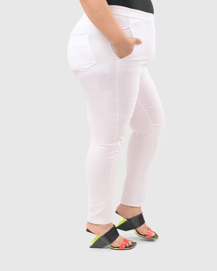 Why perfect? It's all about the flattering fit and the amazing comfort—and everyone needs a pair of white jeans for Summer! The all-around stretch waist has a wider band for a smooth, flat front. The leg is perfectly tapered to hug your curves from hip to hem. Detailed with mock fly, angled side pockets, yoked back and patch pockets. PLUS CAPSULE: 1X,2X,3X for a roomier fit throughout Cathy is 5'9" & wears 1X (16-18) 72% viscose + 23% nylon + 5% elastane Machine wash, tumble dry low Designed & m White 4-way Stretch Pants For Spring, White Fitted Mid-rise Jeggings, White Stretch Mid-rise Jeans, White 4-way Stretch Straight Leg Bottoms, White Cotton 4-way Stretch Bottoms, White Stretch High Rise Jeggings, White Stretch High-rise Jeggings, White Comfort Stretch Bottoms For Spring, White Fitted Casual Jeggings