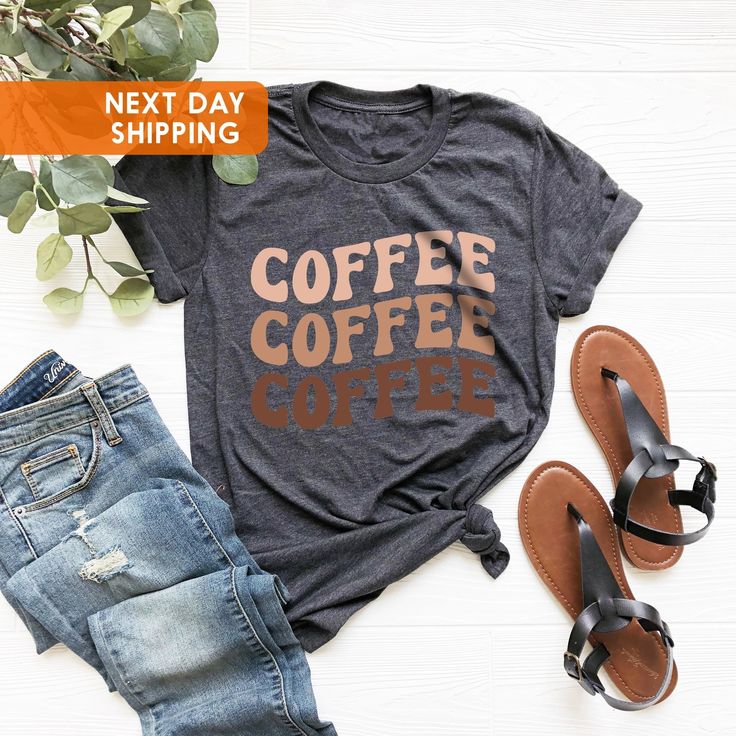 Coffee Coffee Coffee Shirt, Iced Coffee Shirt, Coffee Addiction Shirt, Coffee Lover Shirt, Gift for Her, But First Coffee, Gift For Mom BLACK TEXT is used for Yellow, Heather Peach, White, Light Gray Heather, Mint, Pink Shirts. Other colored shirts have white text. F I T ∙ & ∙ S I Z I N G : -->Women's sizes are narrower than the waist. -->Sleeves are rolled up in some product pictures. They do not come rolled up on delivery. T I M E ∙ T O ∙ D E L I V E R Y : -->Processing and production time is Coffee Short Sleeve Shirt With Letter Print, Coffee Colored Short Sleeve Shirt With Letter Print, Relaxed Fit Coffee Top With Funny Print, Coffee Colored Cotton Top With Funny Text, Coffee Color Cotton Top With Funny Text, Iced Coffee Shirt, Christmas Gift Mom, Mom Black, Coffee Christmas