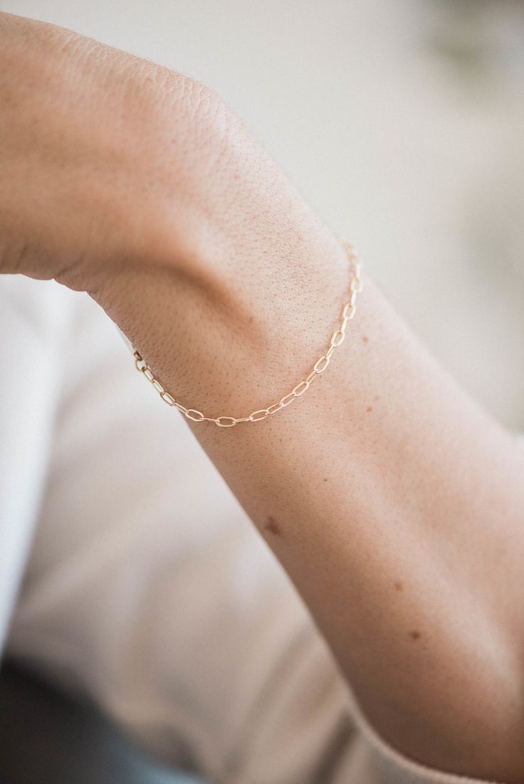 Our Small Paperclip chain has elongated links measuring 2.25 x 5mm in 14k gold filled, sterling silver and rose gold filled metals. Our favorite laying combo is a the Paperclip as a texture, then add a straight line chain like the Curb Chain. Lengths Bracelets: 6", 7", 8" with a .5" adjustable ending Anklets: 7", 8", 9", 10" with a 1" adjustable ending Necklaces:: 14", 16", 18" with a 1.5" adjustable ending Packaged in our logo stamped gift boxes, ready for gift giving. Layering chains are cut f Layering Chains, Chain Layering, Paperclip Bracelet, Dainty Bracelet, Bridesmaid Bracelet, Straight Line, Dainty Bracelets, Layered Bracelets, Letter Charms