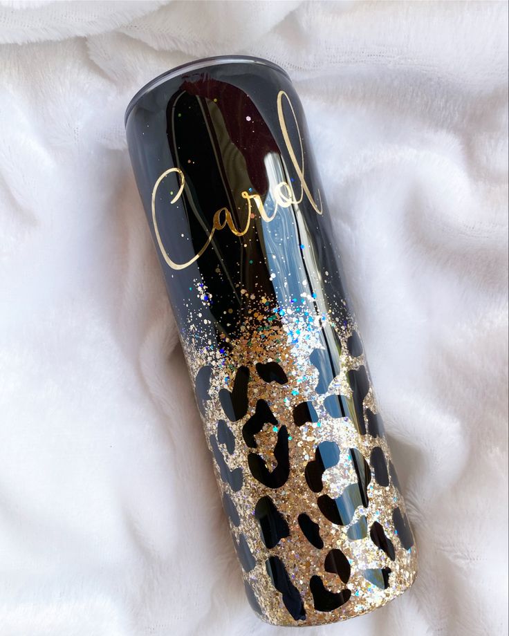 a black and gold leopard print tumble with the name carafe on it