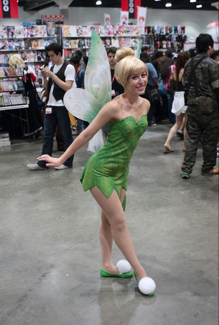 a woman dressed as tinkerbell in a store