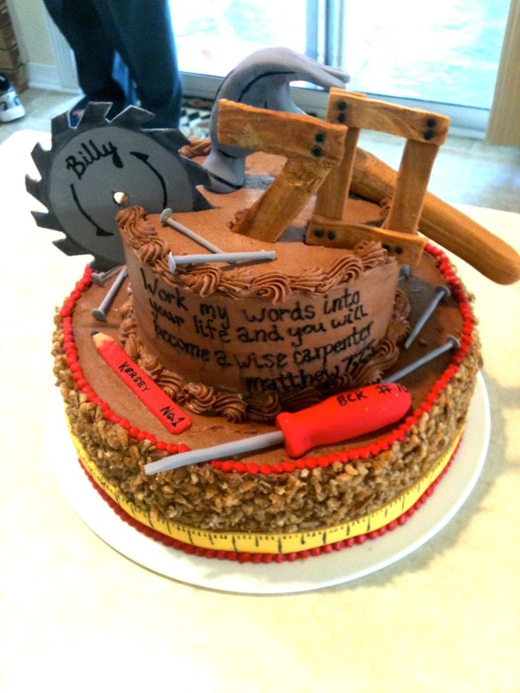 there is a cake that has been made to look like a construction site with tools on it