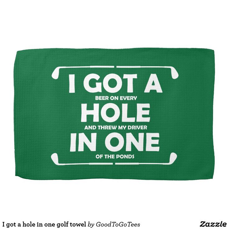 a green towel with white lettering that says i got a hole in one