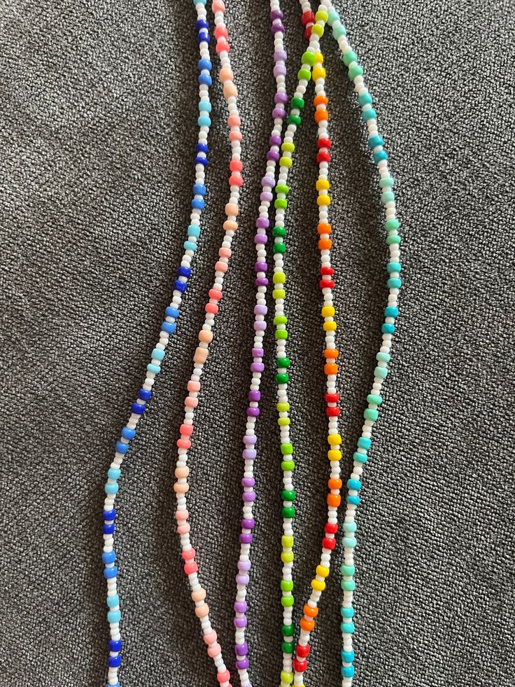 Elevate your style with the vibrant and intricate beauty of our "Radiant Horizons" seed bead necklace. These exquisite pieces are meticulously handcrafted and showcase a stunning array of colours that will add a unique touch of elegance and sophistication to any outfit. Features: - Recycled Materials: Each necklace is threaded on recycled fishing line and all beads come from old jewellery chopped up and upcycled into something new. - Artisanal Craftsmanship: Each necklace is made with precision Diy Seed Bead Necklace, Seed Bead Necklace Diy, Bead Necklace Diy, Pretty Jewelry Necklaces, Bracelets Design, Beaded Necklace Diy, Beads Bracelet Design, Necklace Diy, Fishing Line