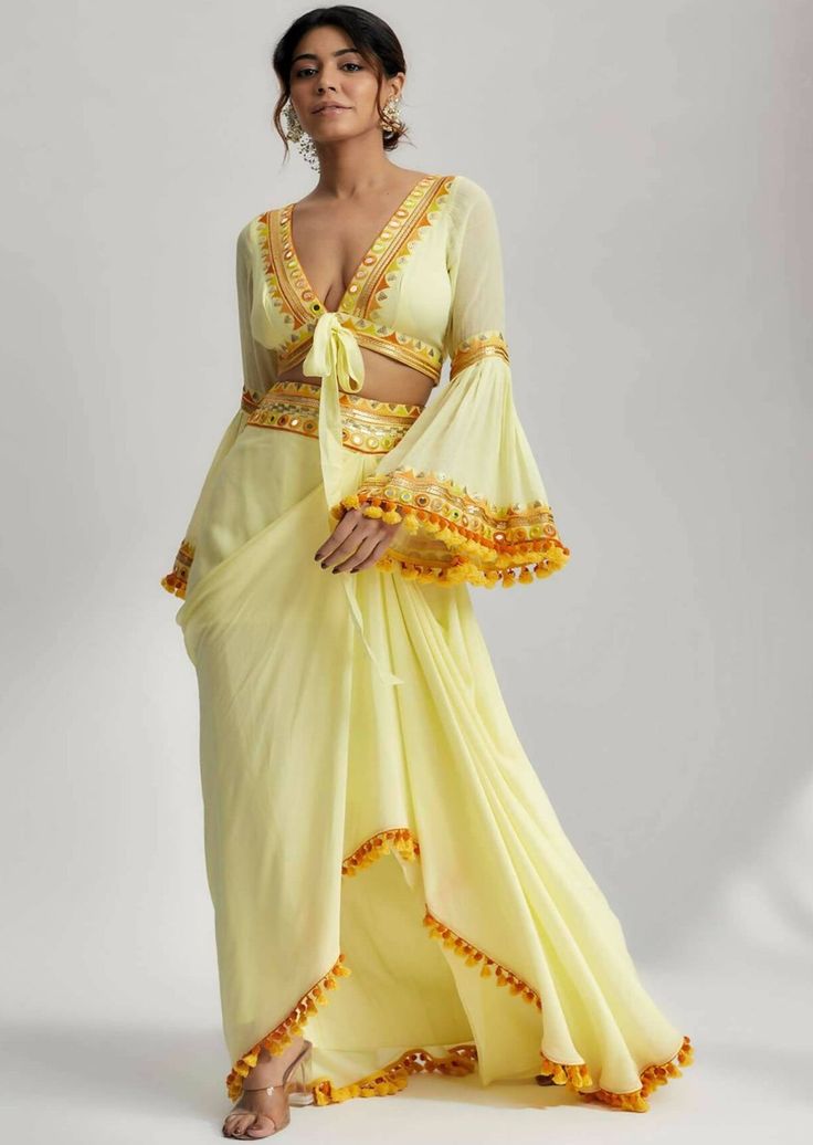 Bohemian Dress With Cutdana In Traditional Drape, Bohemian Georgette Pre-draped Saree For Festive Occasions, Bollywood Party Pre-draped Saree With Tassels, Bohemian Pre-draped Saree For Navratri, Elegant Eid Sets With Tassels, Bollywood Style Pre-draped Saree With Tassels For Party, Traditional Embellished Saree Set, Cutdana Sets For Party Festivals, Festival Cutdana Sets For Party