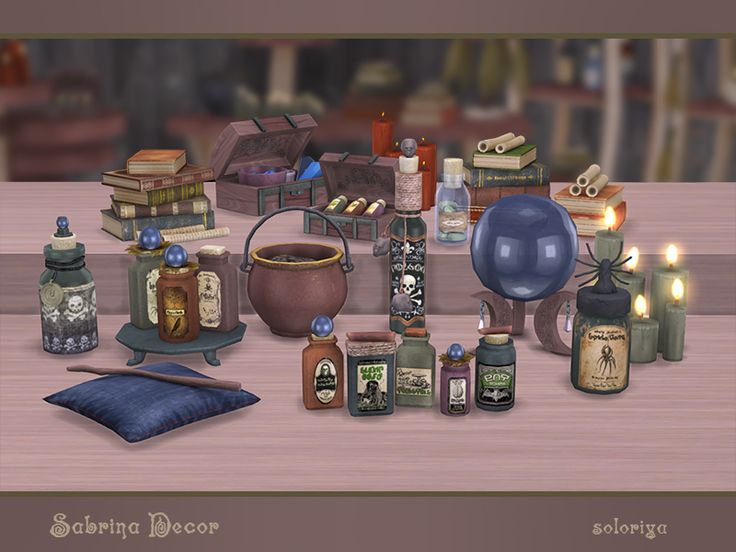 there are many items on the table with candles and books around them, including an egg