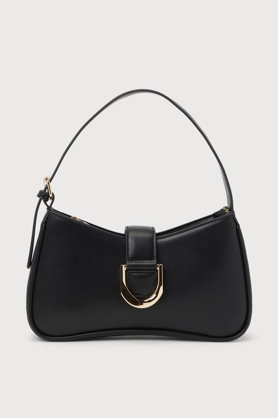 The Lulus Oh-So Chic Black Buckle Shoulder Bag was made for every girl-on-the-go! Smooth faux leather shapes this ultra-chic handbag with a structured design and an adjustable shoulder strap. A wide strap with an oversized buckle detail and a hidden magnetic closure lifts to reveal a zippered top that opens up to a lined interior with a sidewall pouch and zippered pocket. Gold hardware throughout creates an elevated look! Lined. Bag Measures 10. 5" Wide, 6" Tall, And 2" Deep. Adjustable Shoulder Chic Baguette Bag With Adjustable Handle, Trendy Hobo Bag With Adjustable Strap For Office, Trendy Office Hobo Bag With Adjustable Strap, Chic Hobo Satchel Bag With Single Handle, Trendy Top Handle Shoulder Bag With Gold-tone Hardware, Chic Shoulder Bag With Single Handle For Daily Use, Chic Everyday Shoulder Bag With Single Handle, Trendy Office Shoulder Bag With Gold-tone Hardware, Trendy Bags With Gold-tone Hardware And Double Handle