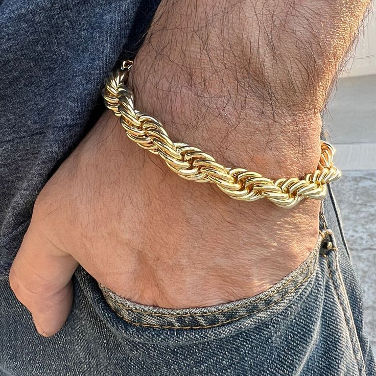 Express your bold attitude with this Men's 14k Gold Plated Twisted Rope Chain Bracelet by Bling Cartel. Perfect for any occasion, this 10MM thick piece is sure to catch everyone's attention. The lobster clasp ensures a secure fit. #MensJewelry #HipHopJewelry #MensBracelet #BlingCartel #RopeBracelet #Bracelet #GoldBracelet #HipHopBracelet # #eBayStore Rope Chain Bracelet Men, Adjustable Gold Curb Chain Jewelry, Gold Rope Chain Bracelet, Classic Gold Bracelets With Rope Chain, Adjustable Gold Rope Chain Bracelet, Metal Jewelry With Rope Chain And Round Shape, Metal Jewelry With Round Rope Chain, Round Metal Jewelry With Rope Chain, Elegant Rope Chain Jewelry In Cuban Link Style