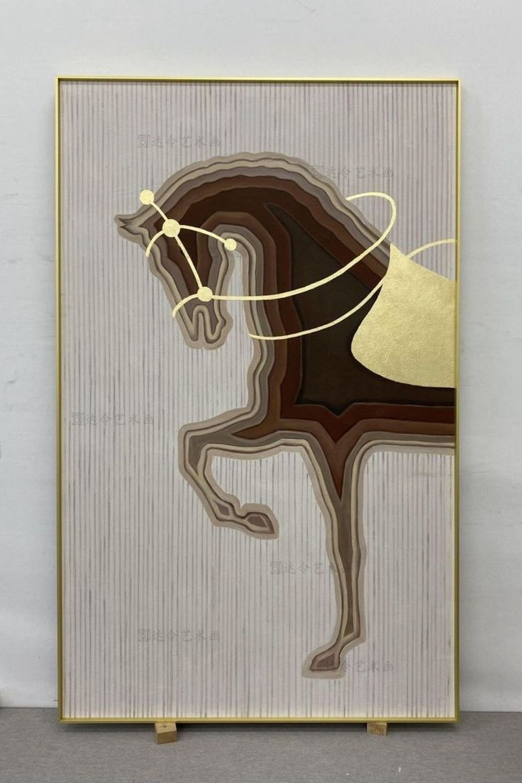 a painting with a horse on it in gold and brown colors, against a white wall