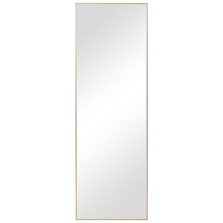 a white and gold framed mirror on a wall