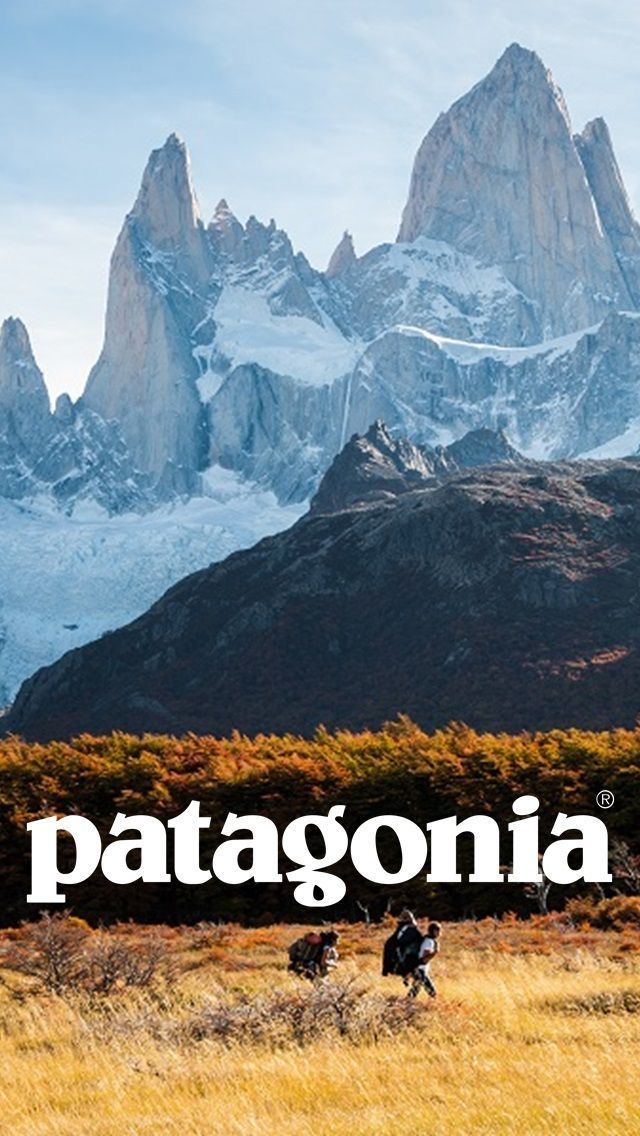 the patagonia mountains are covered in snow and brown grass, with people walking through it