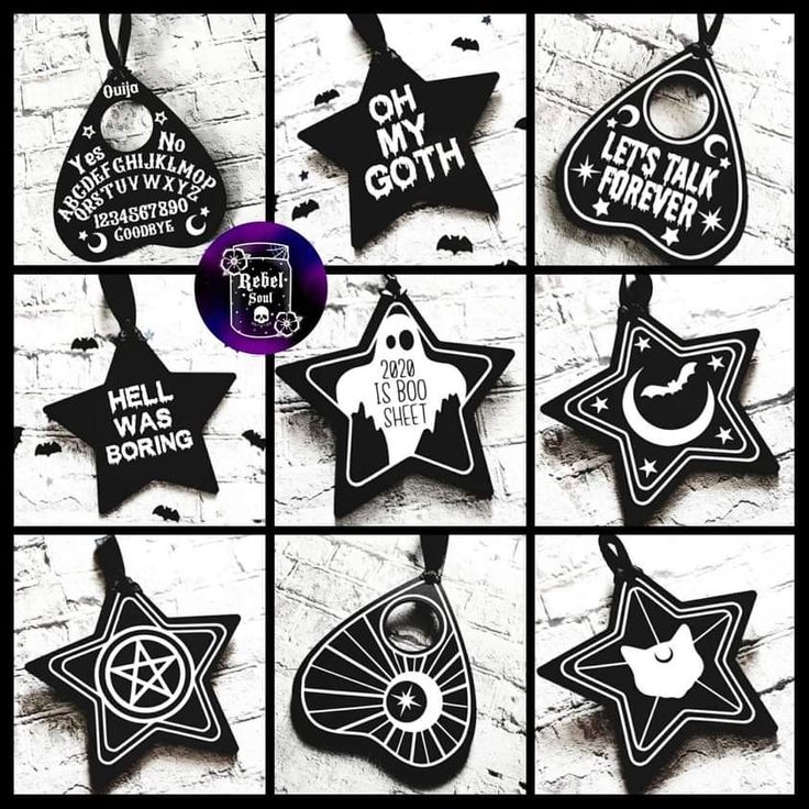 six different black and white ornaments hanging on a brick wall with the words, let's my goth