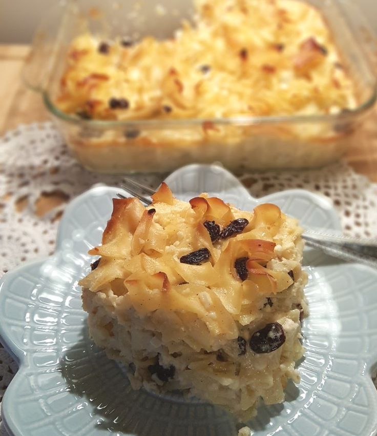 a close up of a plate of food with a casserole in the background