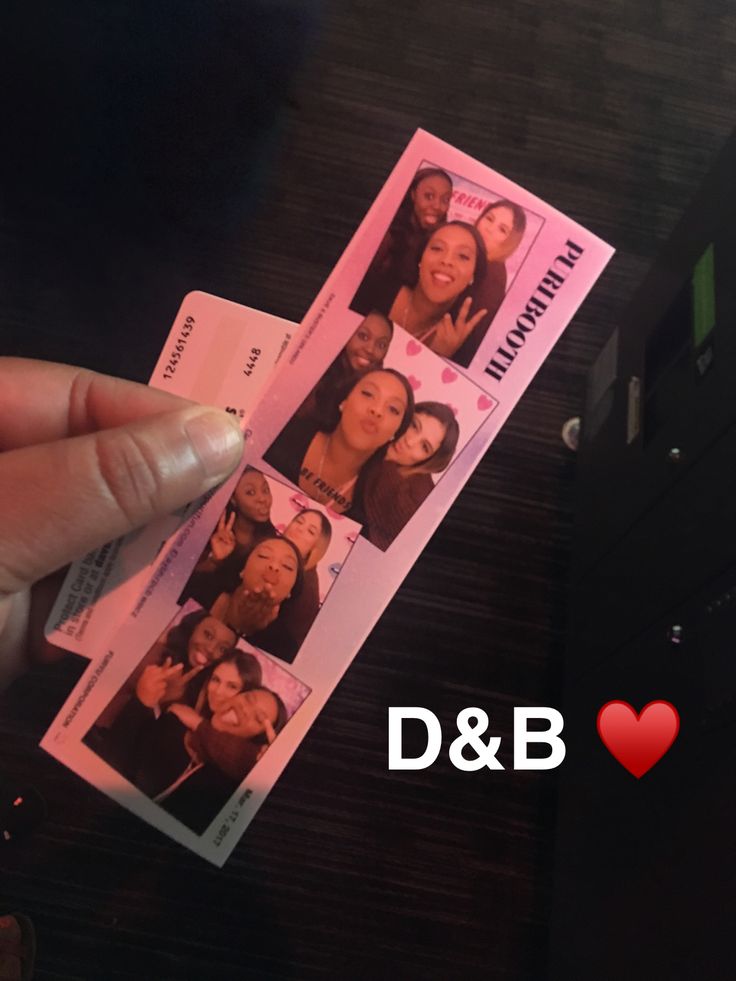 someone is holding up two pink tickets with photos on them and the words d & b