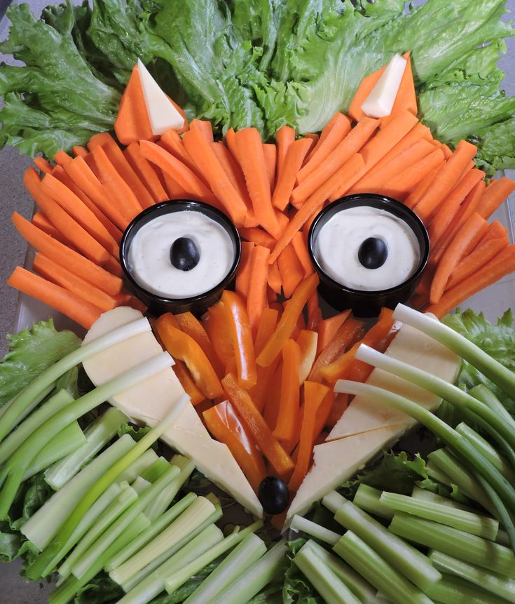 a face made out of carrots and celery