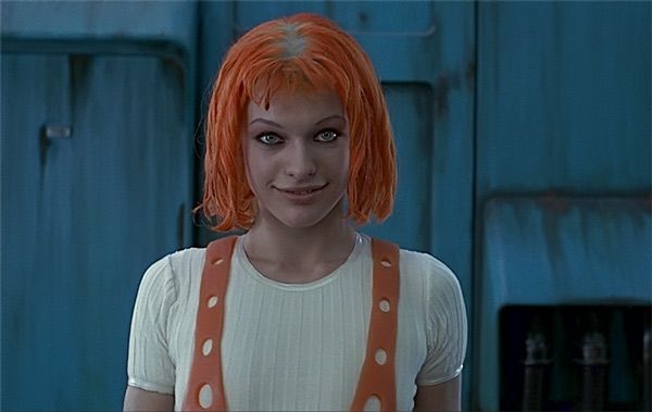 a woman with orange hair wearing an orange suspender