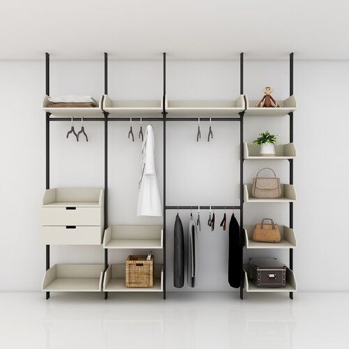 an organized closet with clothes, shoes and handbags on shelving unit in white room