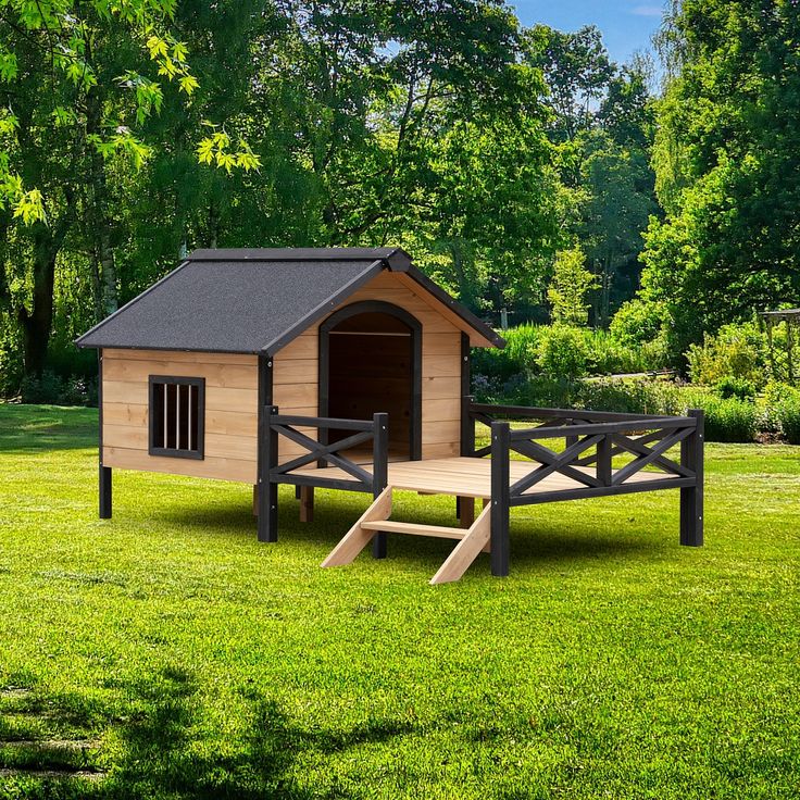 a dog house with a wooden bench in the grass