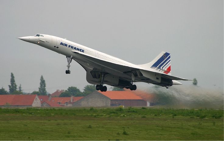 an air france jet taking off from the runway with it's landing gear down