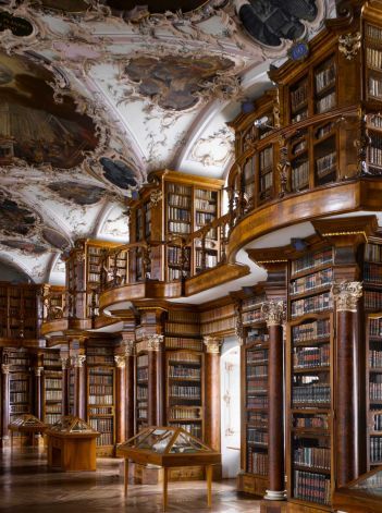 an ornate library filled with lots of books