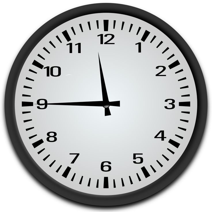 a black and white clock with the time at 11 00 on it's face