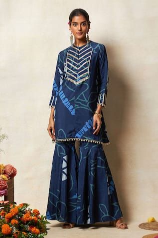 Blue kurta with abstract bandhani print and zari embroidery on the yoke and sleeves. Paired with a printed sharara. - Aza Fashions Blue Sharara With Straight Kurta For Festive Occasions, Festive Blue Sharara With Straight Kurta, Blue Palazzo Set With Dori Work For Diwali, Designer Blue Sharara For Diwali, Anarkali Style Indigo Wedding Sets, Wedding Indigo Sets With Dupatta, Indigo Wedding Sets With Dupatta, Indigo Wedding Set With Dupatta, Unstitched Blue Sharara With Gota Work