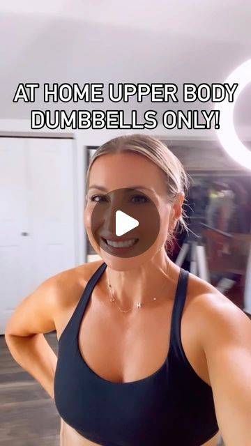 a woman in a sports bra top with the words at home upper body dumbbells only