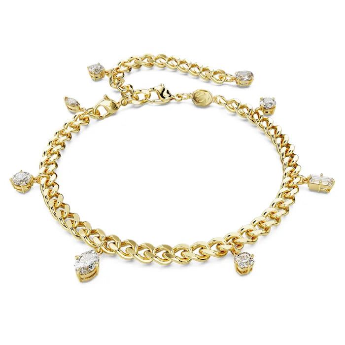 This Dextera design is a versatile piece. A removable extender transforms the bracelet into an anklet for extra styling options. The gold-tone plated design features a linked chain adorned with hanging crystals in various shapes and sizes, and a single Swarovski Zirconia on the elongation. Crafted with exquisite detail, it looks stunning worn either way. Elegant Metal Chain Bracelet With Dangling Charms, Gold-tone Chain Charm Bracelet, Adjustable Chain Dangle Bracelet, Metal Charm Bracelet With Dangling Charms, Elegant Gold Crystal Anklets, Adjustable Gold Crystal Anklets, Gold Crystal Chain Bracelet, Gold Plated Dangle Chain Bracelet, Cubic Zirconia Dangle Bracelets