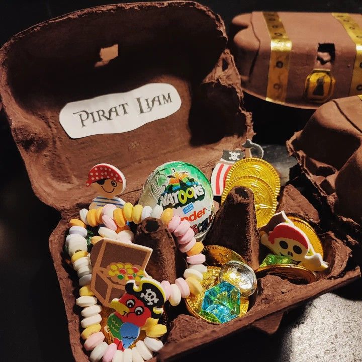 an open trunk filled with lots of different types of beads and charms on top of it