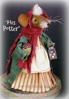 a mouse dressed in a dress and holding a lantern