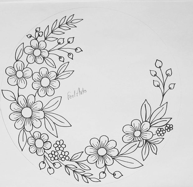 a black and white drawing of a flower wreath