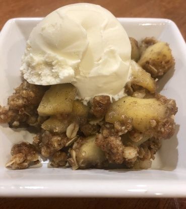 a white plate topped with fruit and ice cream