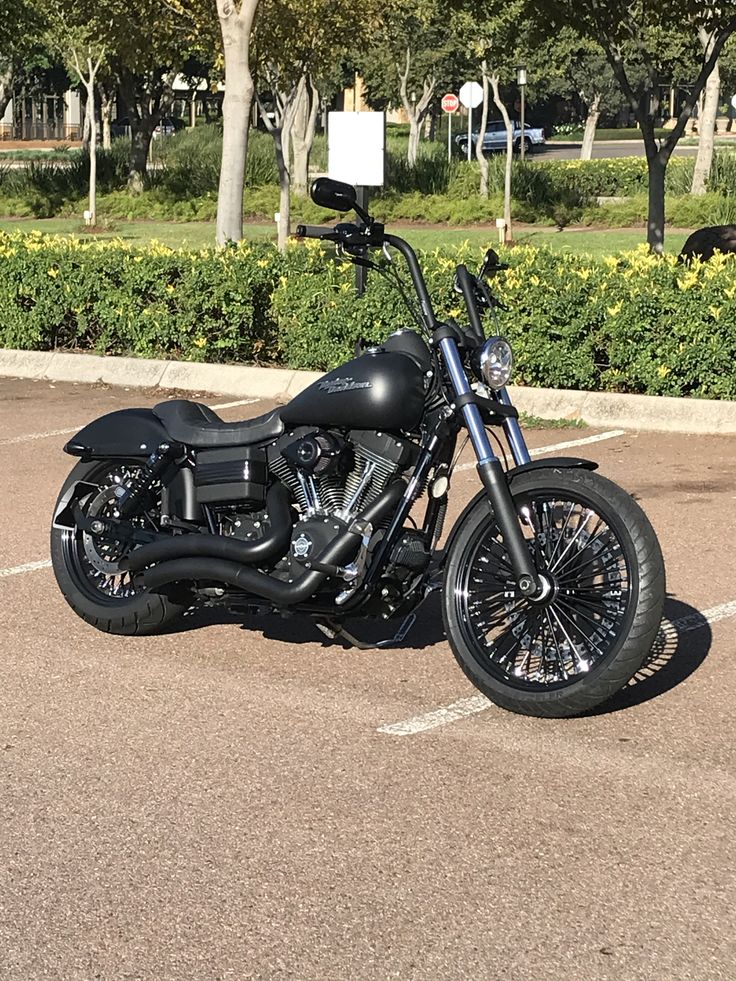 a black motorcycle parked in a parking lot