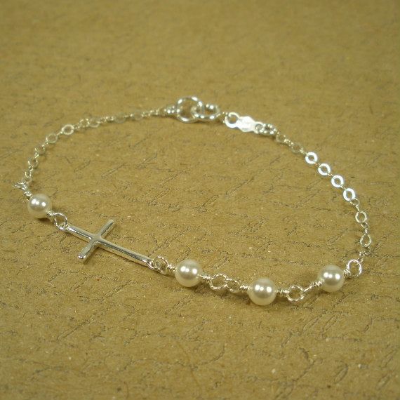 This dainty sideways cross bracelet is made with sterling silver and Swarovski pearls. The pearls are carefully hand-wired and connected together. On the clasp, there is a .925 sterling silver quality tag for a beautiful and elegant feel. Sterling silver Cable chain with spring clasp Swarovski white pearls Chain extender available here: https://goo.gl/JJlqbR Our jewelry comes carefully wrapped in a beautiful gift box with jewelry care instructions. Sterling Silver Jewelry Cleaner, Silver Cross Bracelet, Bracelet Extender, Silver Jewelry Cleaner, Christian Bracelets, Dainty Bracelet, Etsy Bridesmaid Gifts, Bridesmaid Bracelet, Chain Extenders