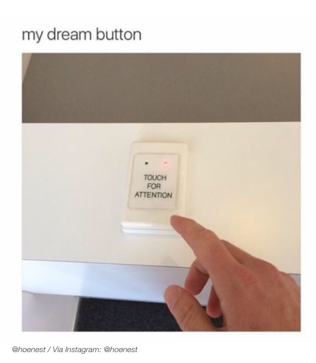 a hand pointing at a button that says,'my dream button touch the attention '