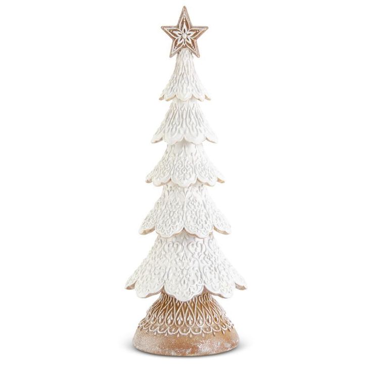 a small white christmas tree with a star on it's top, sitting in front of a white background