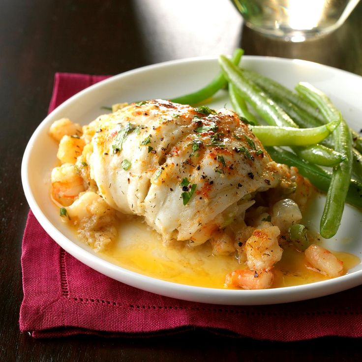 a white plate topped with chicken and green beans