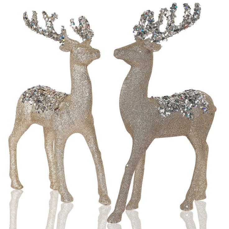 two silver glitter deer figurines on white background