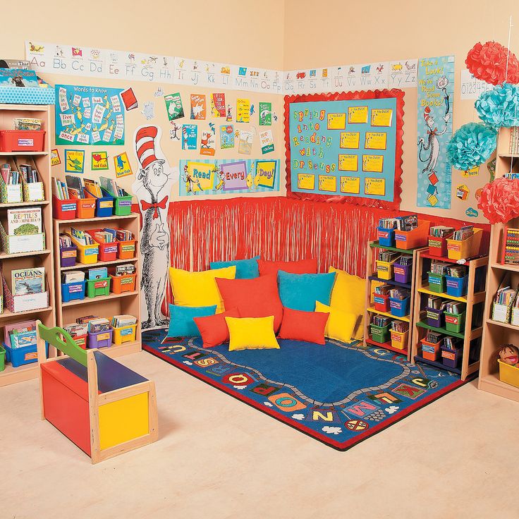 a child's playroom with bookshelves and toys