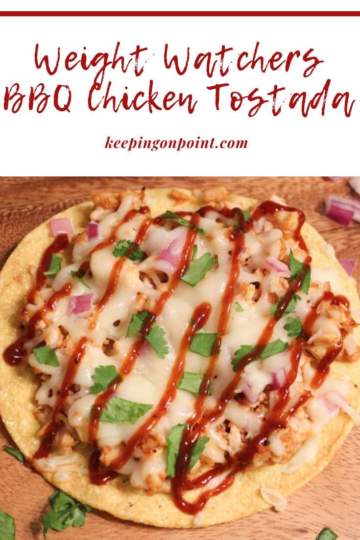 a pizza covered in cheese and sauce on top of a wooden cutting board with the words weight watchers bbq chicken tostada